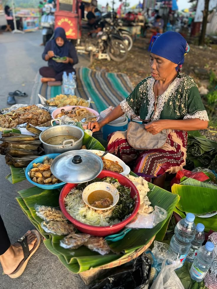 A vendor serving food from a roadside market stall